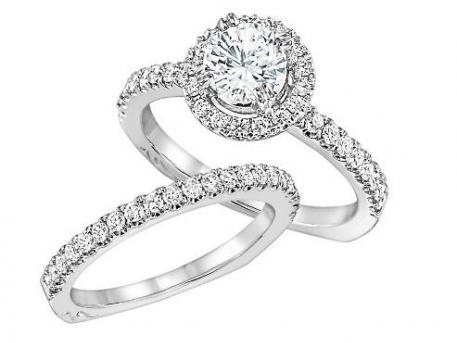 Niki J - This diamond halo engagement set contains round brilliant cut diamonds prong set around the center diamond and down the shank. The set can be cast in 14k or 18k white or yellow gold and can hold from a .50ct to 2ct diamond in the center. Call For Price
