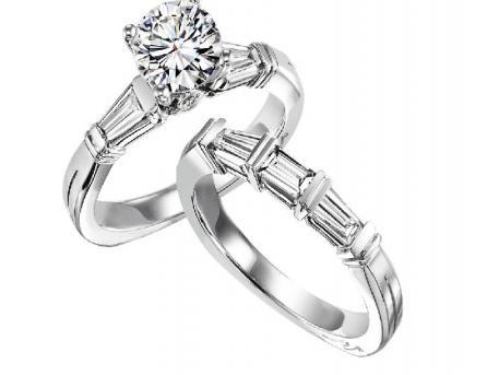 Niki J - This engagement set contains baguette cut diamonds on each side of the center stone. The set can be cast in 14k or 18k white or yellow gold and can hold from a .50ct to 2ct diamond in the center. Call For Price